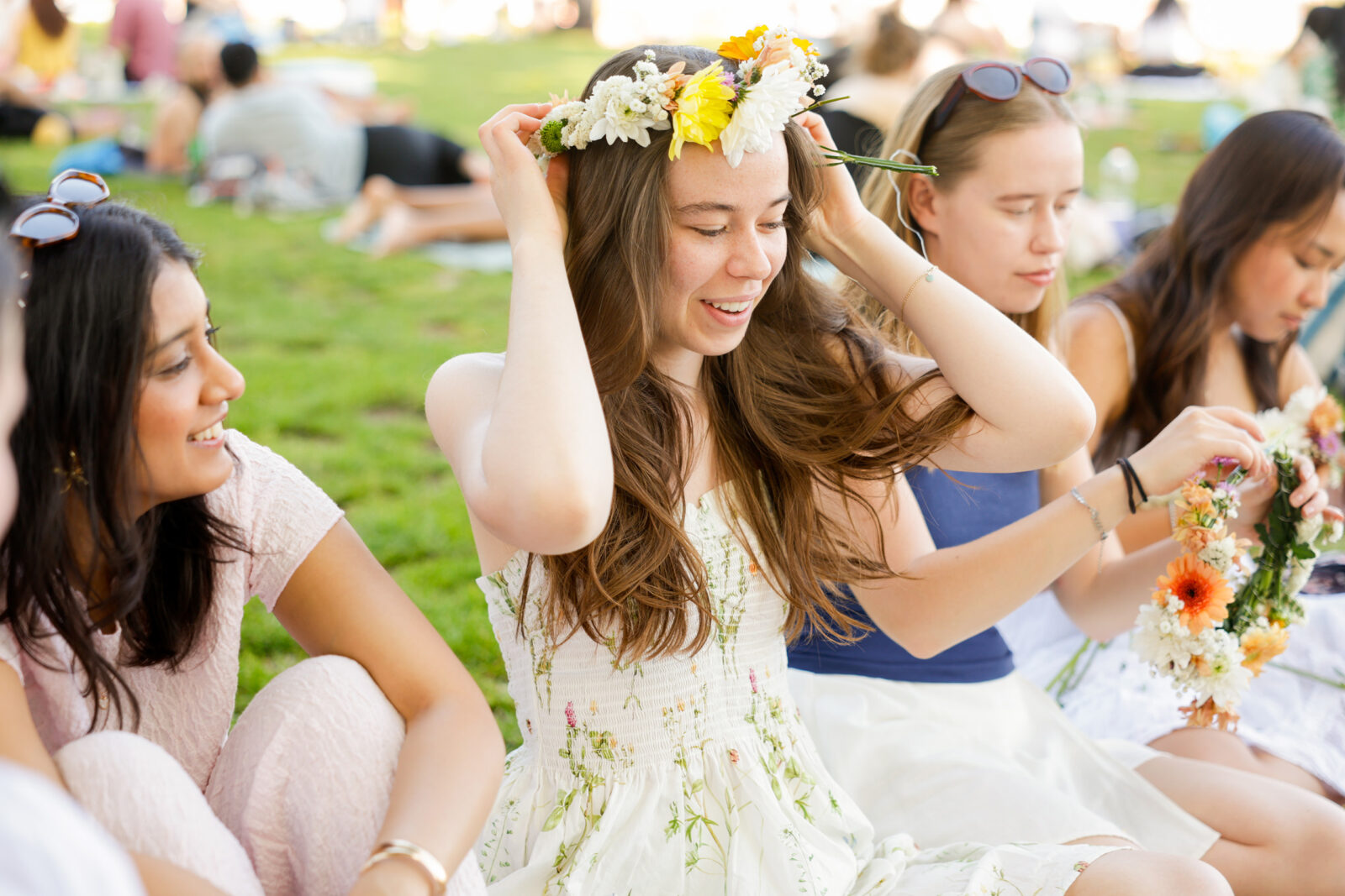 A student tries on her selfmade flower crown